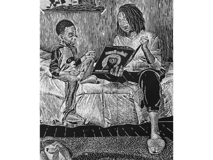 A black and white print shows a mother sitting on a bed and reading to her son before bedtime.