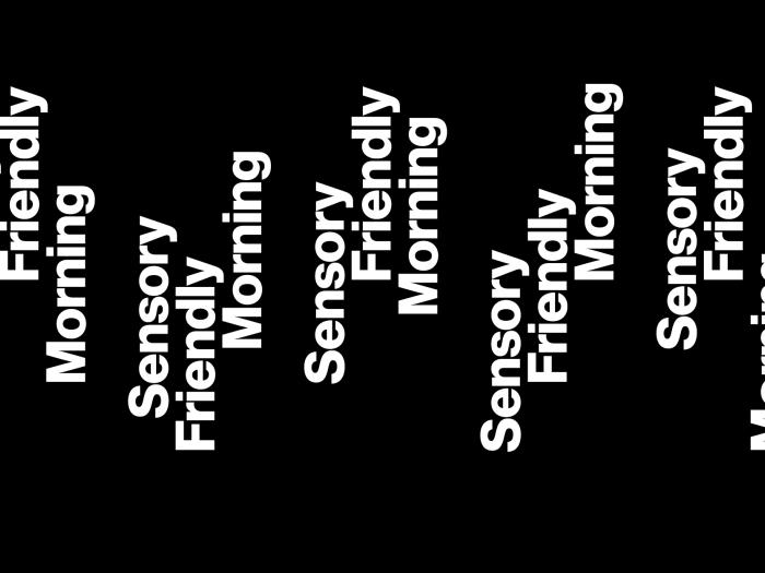 White text against a black background that reads "Sensory Friendly Morning." The text is turned sideways and repeats along the length of the graphic.