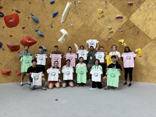 Photo of Summer Adventures camp counselors in front of a rock wall.